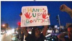 Demonstrators with Sign "Hands up Don,t Shoot"